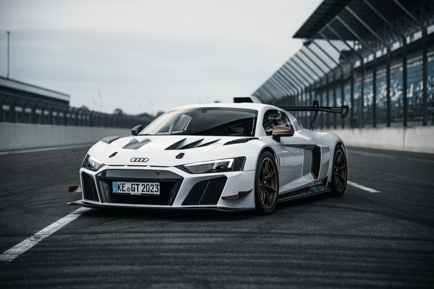 Black and white XGT from the side front view on the racetrack
